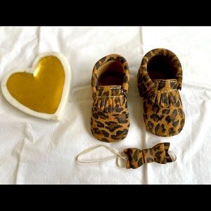 Freshly picked size 3 leopard moccasins with matching bow.